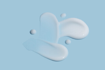 Cream texture strokes. Facial cream swatches. Face cream cosmetic product smear swatch on blue background