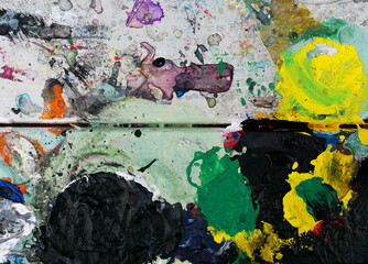 close-up of an artist's used dirty paint palette