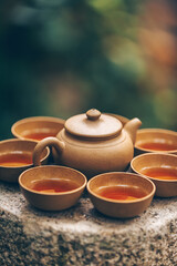 Traditional tea ceremony with a clay teapot and cups, celebrating Asian culture