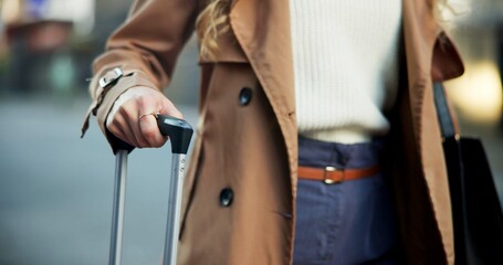 Business, woman and hands with luggage in street waiting for transport service, cab or taxi for...