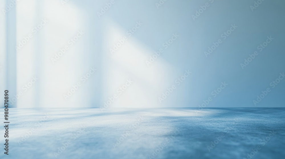 Poster a gentle blur of soft blue hues creating a serene abstract background in a minimalist studio setting