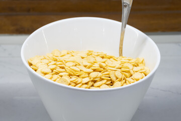 Cornflakes on a White Plate - Side View