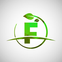 English alphabet F with circle leaf and swoosh. Eco-friendly logo concept. Low poly logo for ecological business and company identity