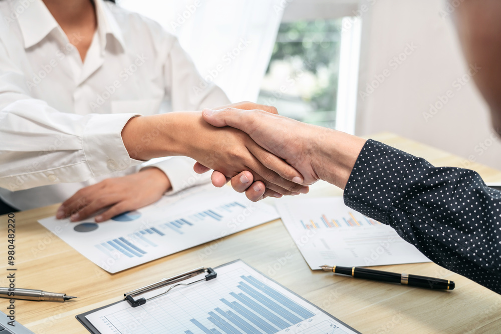 Poster a handshake between two people in a business setting
