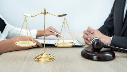 Male lawyer or notary working consulting and discussion to businesswoman client in the office, Law and Legal services concept