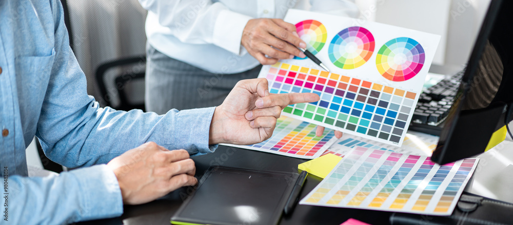 Poster Team of creative graphic designer working on color swatch samples chart for selection coloring in inspiration to create new collection at workplace
