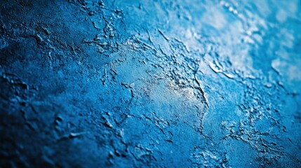 Fototapeta premium Blue textured background with a rough and gritty surface giving a tactile feel Close-up photo with clean background