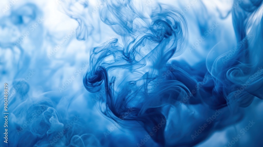 Poster fluid blue ink in water creating swirling and ethereal patterns, evoking a sense of tranquility clos