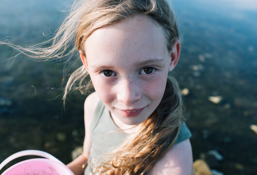 close up portrait of a girl with freckles at the beach in Sweden