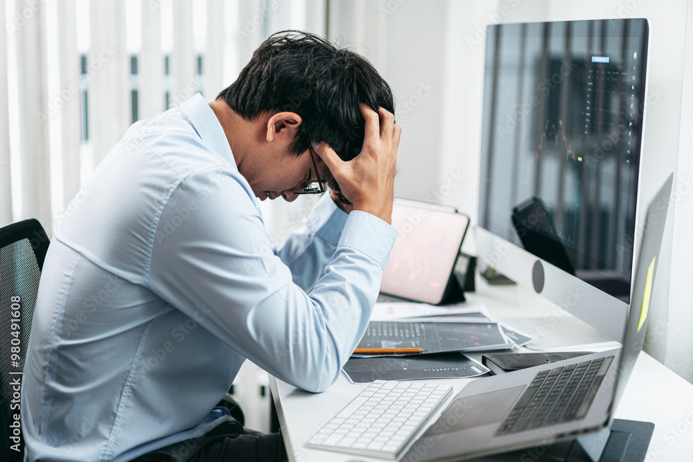 Poster businessman investor working and stress with computer analyzing graph stock market trading planning 