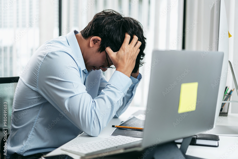 Poster businessman investor working and stress with computer analyzing graph stock market trading planning 
