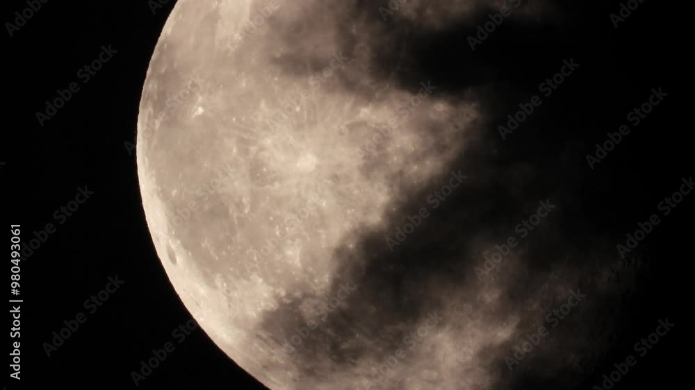 Poster captivating view of the full moon with clouds drifting across the night sky, creating a mysterious a