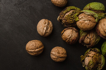 walnut with skin on black background