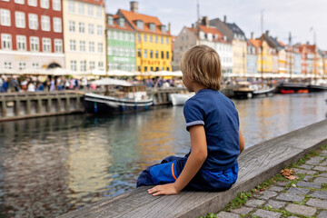 Family with children and pet dog, kids and adults visiting Coppenhagen , capital city of Denmarn...