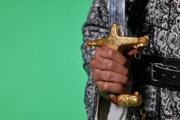 Traditional Saudi out-feet on chromakey. Arabian long saber - saif.