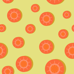 Seamless vegetable pattern with sliced carrots on yellow