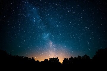 A dark night sky with stars and the Milky Way galaxy in view. 