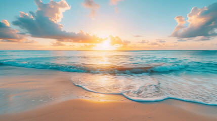Peaceful sunrise over the ocean beach with calm waves touching the shore