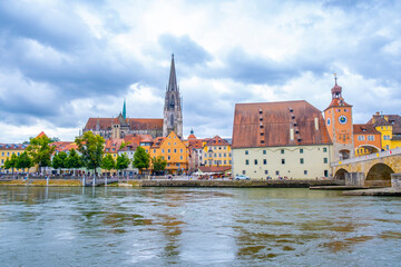 Regensburg, Germany - The picturesque skyline including the stone bridge over the Danube River,...