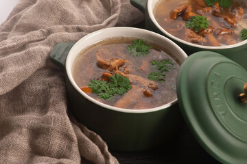 Soup with chanterelle mushrooms close up