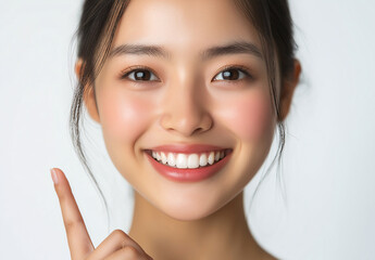 Naklejka premium A woman with a smile on her face and a finger pointing to her nose