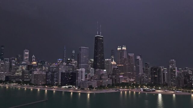 Lightning storm above the Chicago skyline, stormy night in USA - slow motion