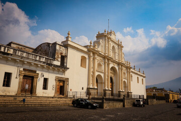 Explore the historic architecture of Antigua, Guatemala under a vibrant sky during the late afternoon