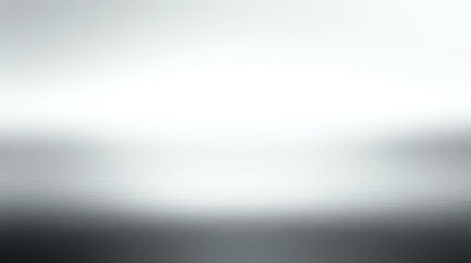 Obraz premium An abstract blurred background featuring soft shades of gray and white, creating a serene and minimalist atmosphere.