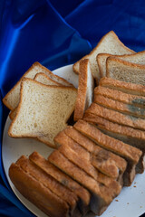 Rotten bread on the white plate