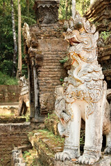 Fototapeta premium A dragon, dog, lion, guardian statue at the Wat Pha Lat Temple next to the Monks Trail up to the Wat Phra That Doi Suthep Temple, Chiang Mai, Thailand