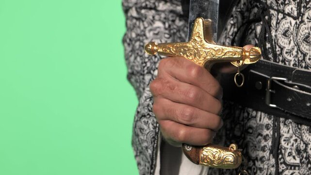 Traditional Saudi out-feet on chromakey. Arabian long saber - saif.