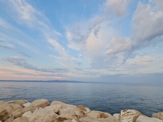 landscape with clouds. boat on the sea. rocks and sea. sunrise over the sea