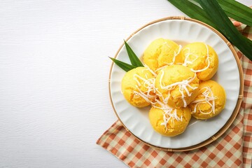 Toddy Palm Cake , thai dessert , thai called khanom tarn in white ceramic plate on white background top view food table with free copy space