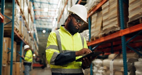 Warehouse, black man and tablet in inspection on logistic, quality control or stock management. Engineer, tech and supervisor in maintenance for freight, supply chain and factory in shipping company