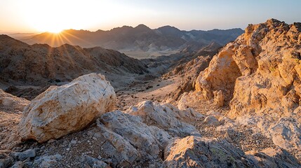 Obraz premium Stunning view of a rugged mountain landscape at sunset, warm light casting dramatic shadows across the terrain, space for text, high-end national geographic photography style, deep depth of field,