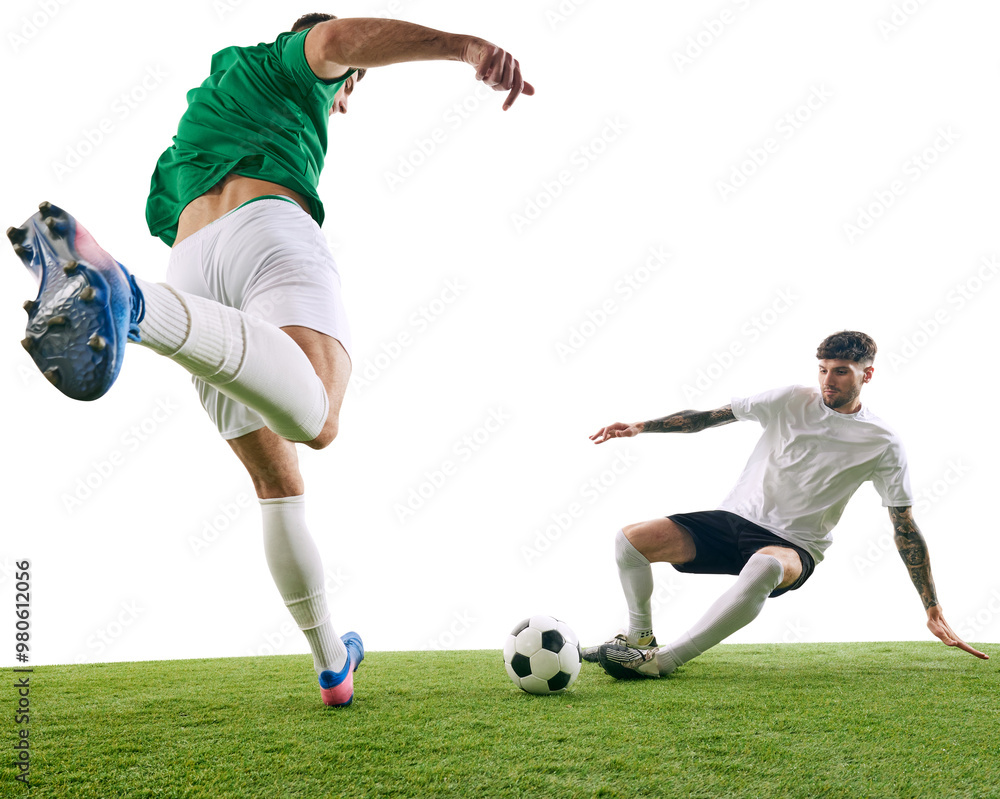 Wall mural Two soccer players, one in white and one in green, fiercely compete for ball on green lash playground against transparent background. Concept of professional sport, championship, final match. Ad