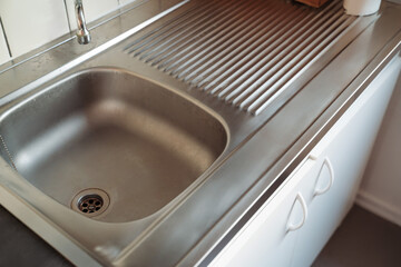 Typical water stained kitchen sink in small French apartments