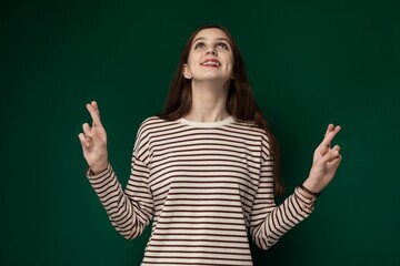 Woman Standing in Front of Green Wall