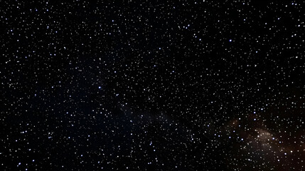 Obraz premium A Night Sky Photo With Hundreds of Stars Shining Brightly in a Black Canvas Background