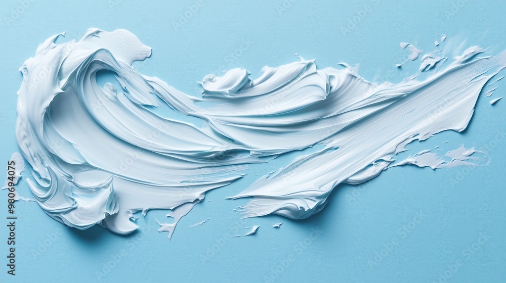 Poster swirls of soft blue cream spread across a light blue canvas creating an artistic abstract design in 