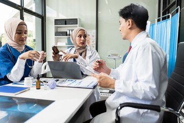 Fototapeta premium Medical team working on digital tablet healthcare doctor technology tablet using computer analyzed the results of medical reports, an online conference at the hospital.