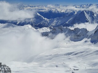 Snow covered mountain top in Austria. View of the Alps from the Zugspitze, the highest mountain in Germany