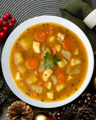 Squid stew with potatoes and vegetables. Top view table with Christmas decoration.
