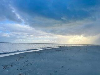 Blue beach and forever blue cloudy sky