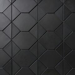 Fototapeta premium close-up view of a dark, hexagonal tile pattern. The tiles are matte black with subtle variations in shading, giving them a slightly textured appearance