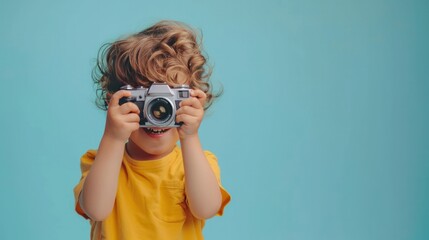 Fun learning, a child experimenting with different angles using a camera