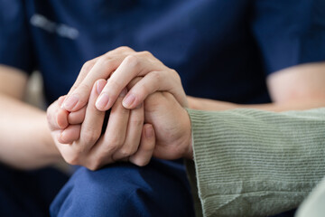 Empathy, trust and nurse caregiver holding hands with patient. consulting support and healthcare advice