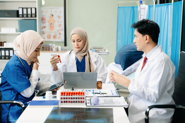 Fototapeta premium Medical, meeting and laptop for team in discussion, brainstorming and planning. Doctor, nurse on desk