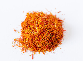 Fototapeta premium Close up shot on the white background of the dried saffron leaves spice. Food