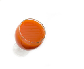 Glass with carrot juice.